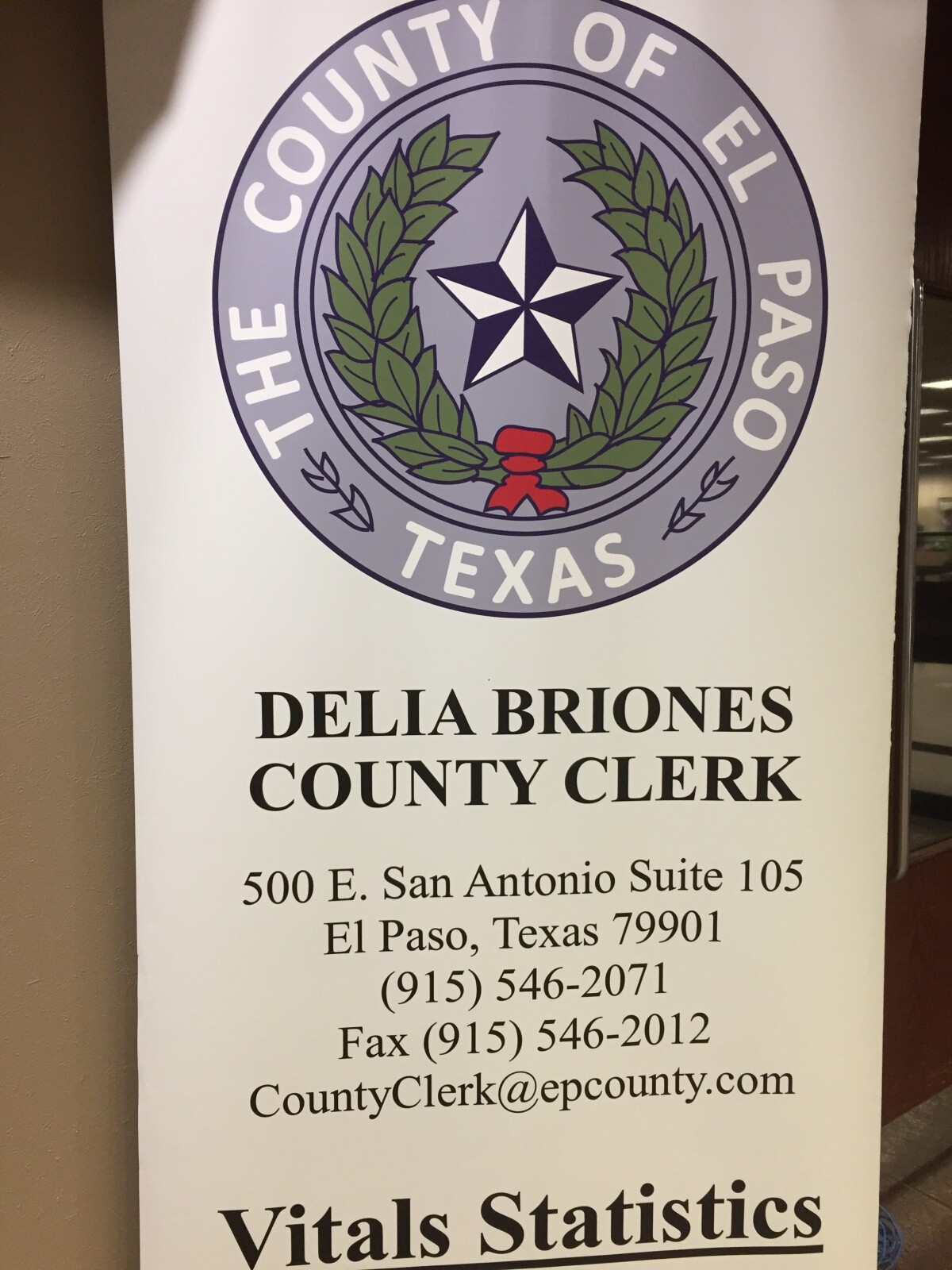 Delia Briones County Clerk sign in County Courthouse
